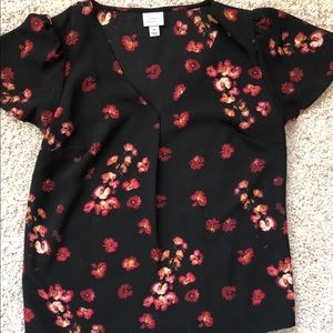 Black floral blouse.